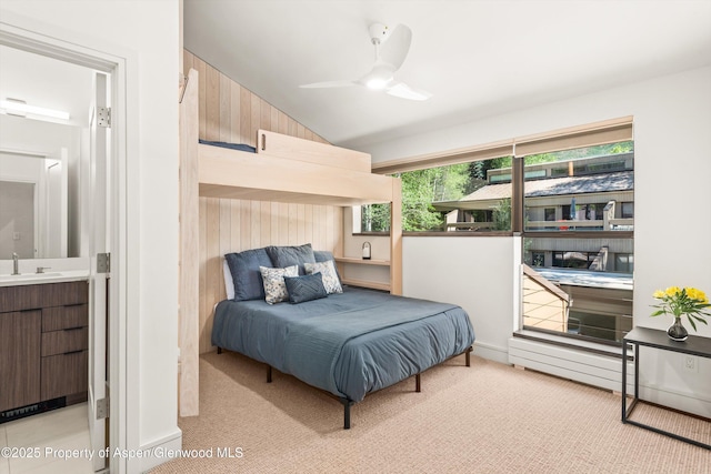 155 Lone Pine Rd Unit 2, Aspen, CO 81611 - carpeted bedroom with wooden walls, lofted ceiling, connected bathroom, and ceiling fan