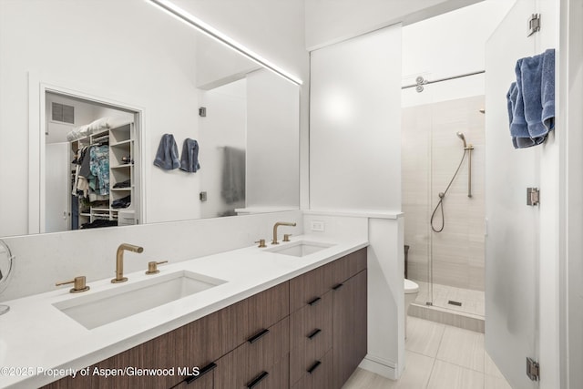 155 Lone Pine Rd Unit 2, Aspen, CO 81611 - full bathroom featuring a shower stall, double vanity, tile patterned flooring, and a spacious closet