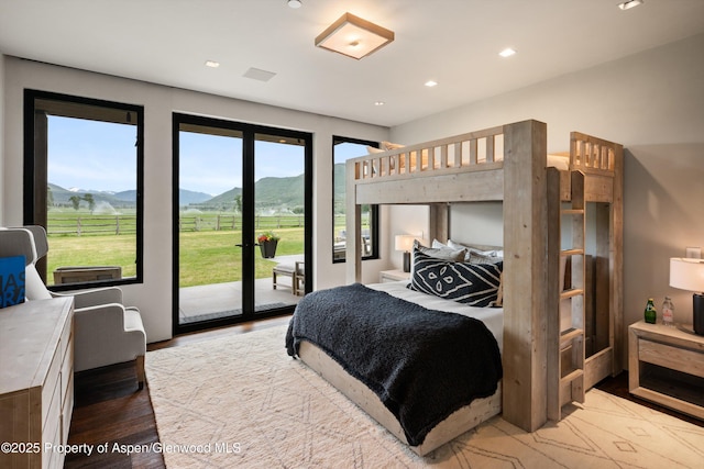 295 Aspen Valley Ranch Rd, Woody Creek, CO 81656 - bedroom with a mountain view, access to exterior, wood finished floors, and recessed lighting