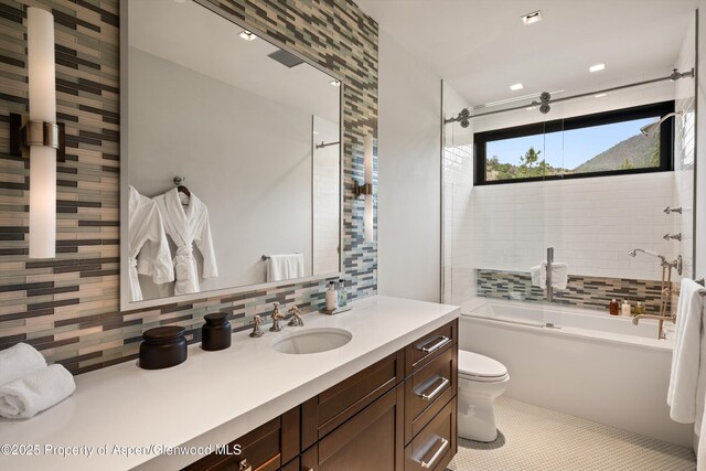 295 Aspen Valley Ranch Rd, Woody Creek, CO 81656 - bathroom featuring toilet, decorative backsplash, vanity, enclosed tub / shower combo, and tile patterned floors