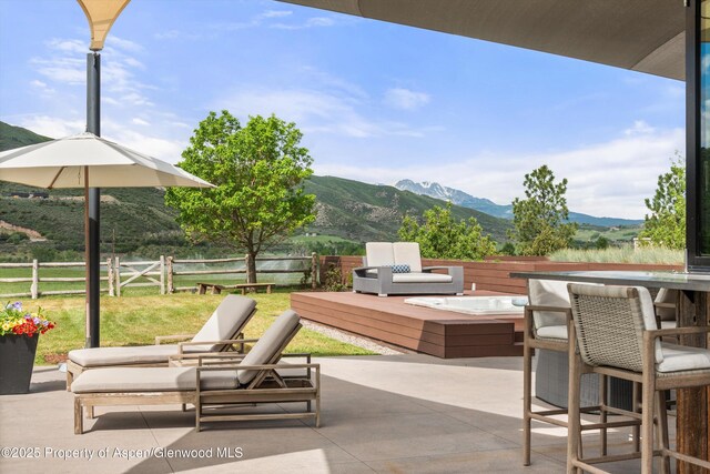 295 Aspen Valley Ranch Rd, Woody Creek, CO 81656 - view of patio with a deck with mountain view