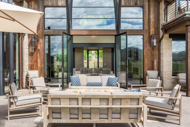 295 Aspen Valley Ranch Rd, Woody Creek, CO 81656 - view of patio featuring an outdoor living space with a fire pit