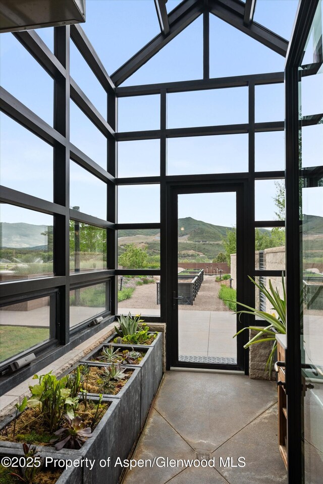 295 Aspen Valley Ranch Rd, Woody Creek, CO 81656 - unfurnished sunroom with a mountain view