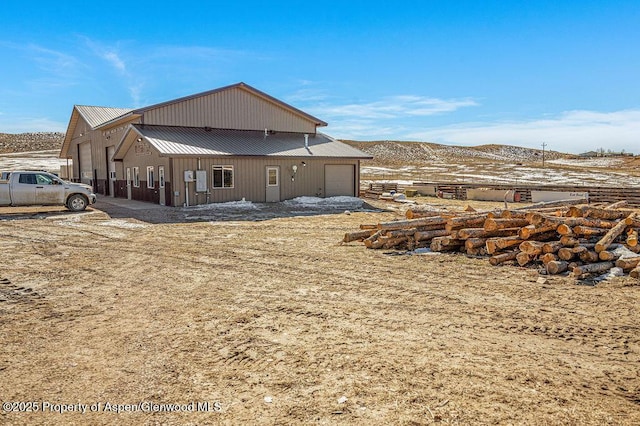 37 Pronghorn Rd, Craig, CO 81625 - back of property featuring metal roof and a mountain view