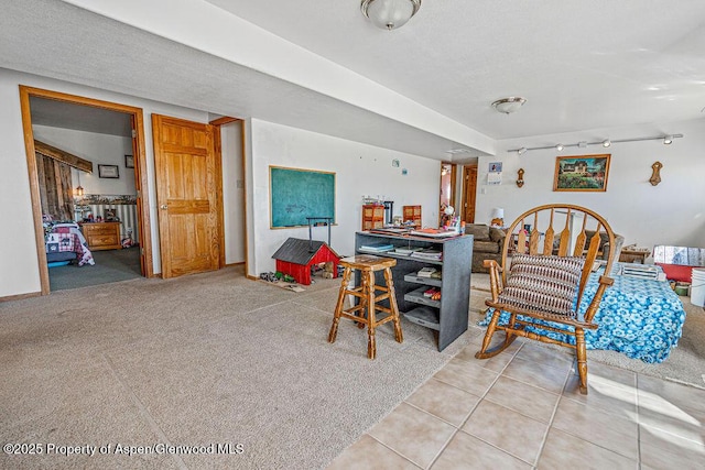 37 Pronghorn Rd, Craig, CO 81625 - carpeted dining room with tile patterned flooring and track lighting