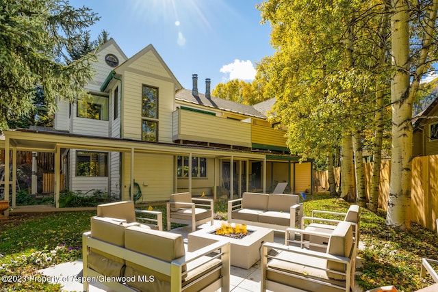 1195 E Cooper Ave Unit A, Aspen, CO 81611 - back of property with an outdoor living space with a fire pit