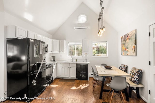 1195 E Cooper Ave Unit A, Aspen, CO 81611 - kitchen featuring black appliances, a wall mounted AC, dark wood-style floors, white cabinetry, and high vaulted ceiling