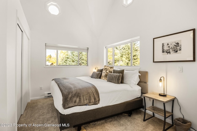 1195 E Cooper Ave Unit A, Aspen, CO 81611 - bedroom with a baseboard heating unit, carpet flooring, multiple windows, high vaulted ceiling, and a closet