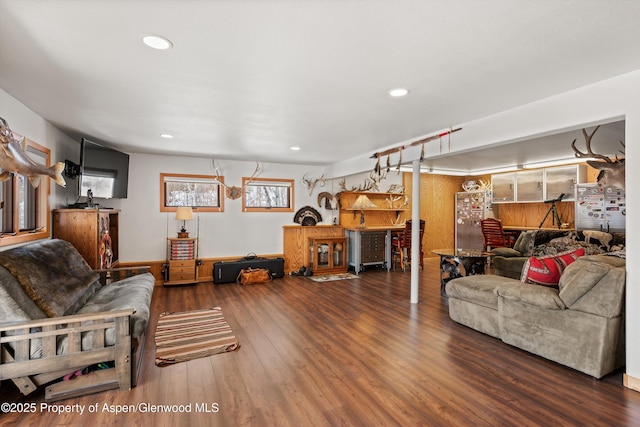 living room with wood finished floors and recessed lighting