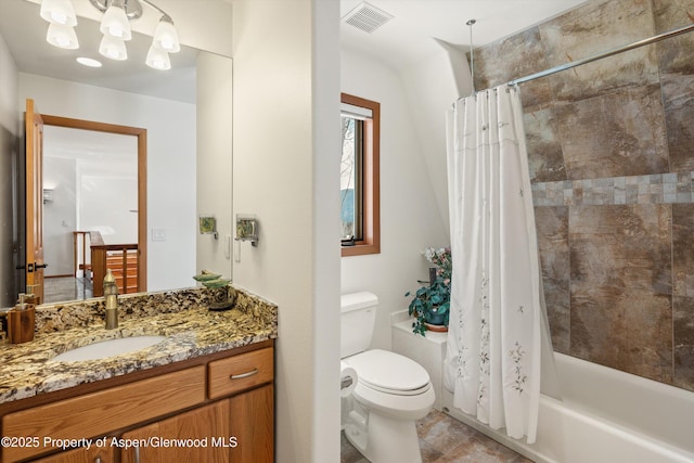 bathroom featuring toilet, vanity, visible vents, and shower / bathtub combination with curtain