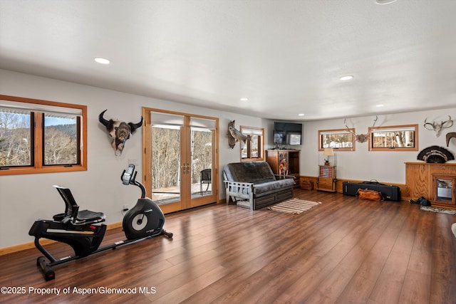 exercise room with recessed lighting, hardwood / wood-style flooring, plenty of natural light, and french doors