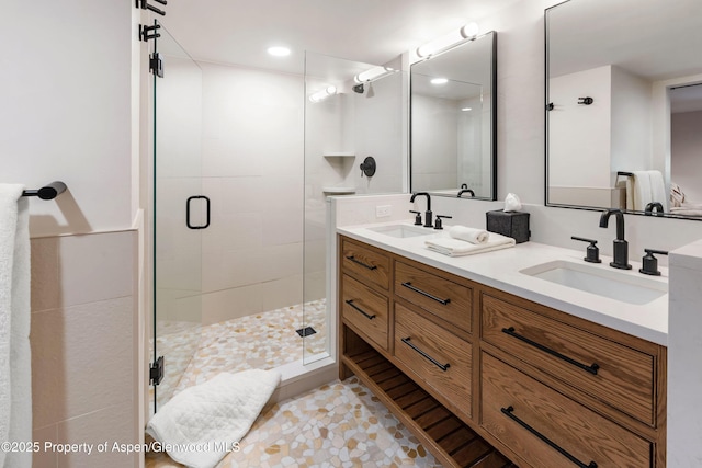 800 S Mill St Unit 105, Aspen, CO 81611 - bathroom featuring a shower stall, double vanity, and recessed lighting