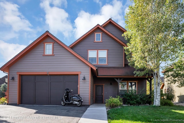 view of front property with a garage and a front yard