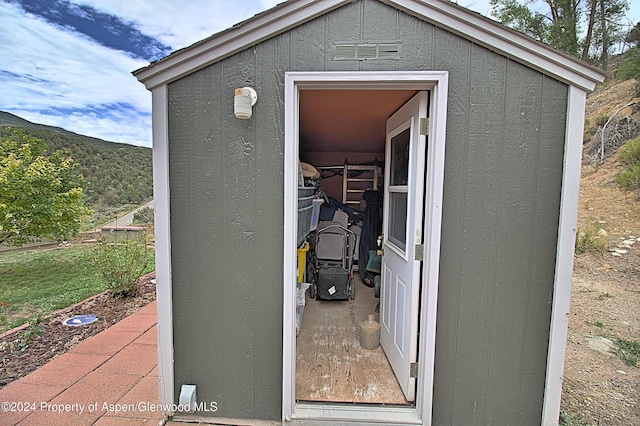 view of outdoor structure featuring a mountain view