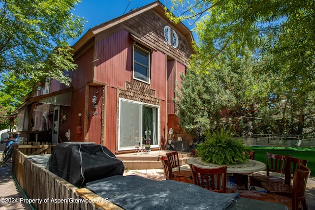 rear view of property featuring a patio