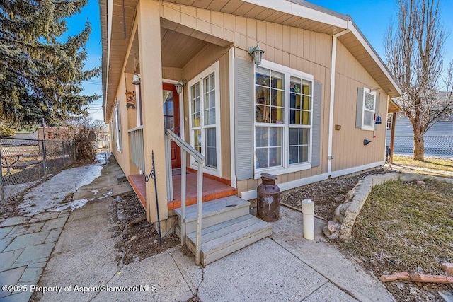 view of side of home with fence