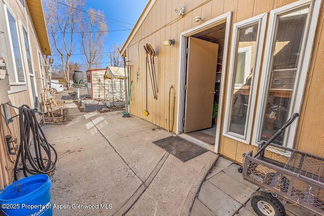 doorway to property with a patio area