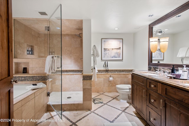 full bathroom featuring plus walk in shower, vanity, toilet, and tile patterned flooring