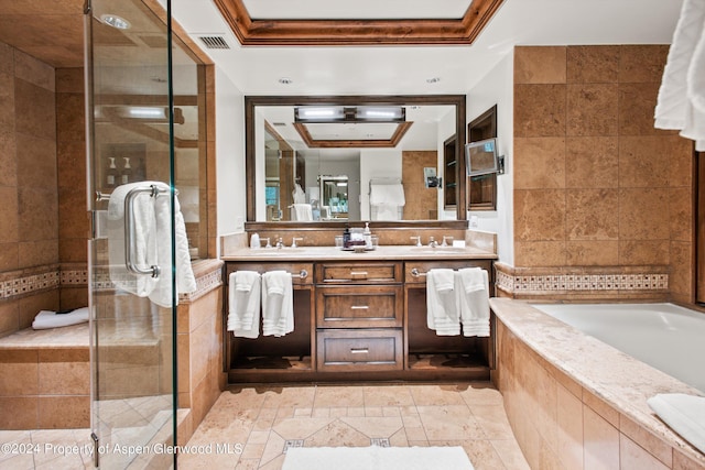 bathroom featuring vanity, crown molding, plus walk in shower, and a tray ceiling