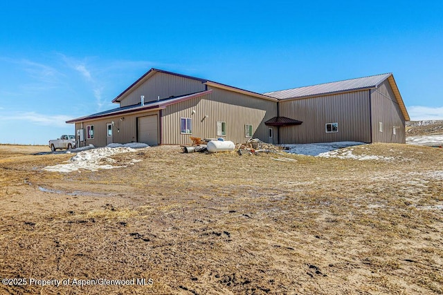 TBD Pronghorn Rd, Craig, CO 81625 - rear view of house featuring a metal roof, a pole building, and an attached garage