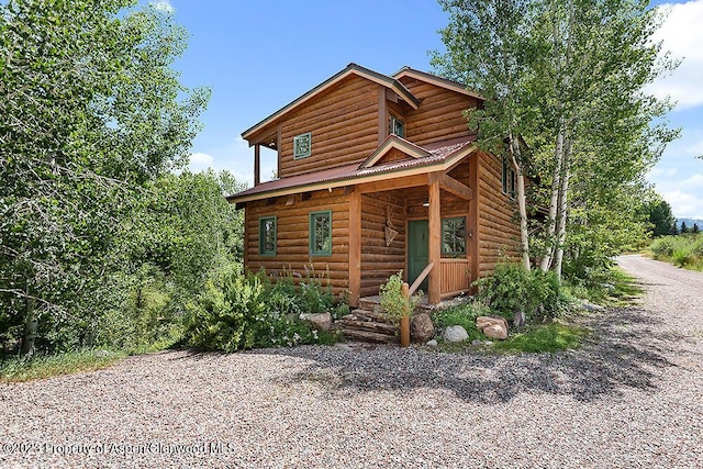 view of log cabin