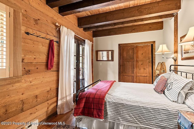 35 Starlit Ln, Snowmass, CO 81654 - bedroom with beam ceiling, wooden walls, dark wood-type flooring, and wood ceiling