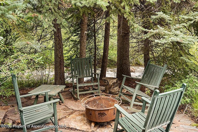 view of patio / terrace featuring a fire pit