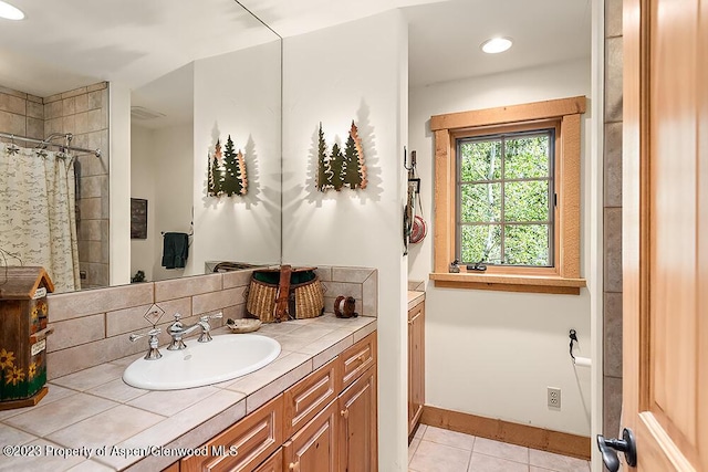 bathroom with vanity, tasteful backsplash, tile patterned floors, and curtained shower