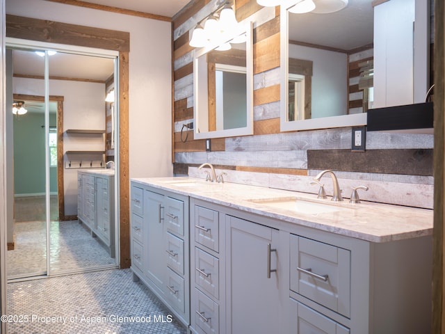 783 Orchard Rd, Montrose, CO 81401 - full bath with ornamental molding, double vanity, and tile patterned flooring