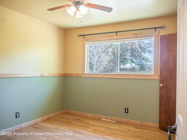783 Orchard Rd, Montrose, CO 81401 - empty room with wood finished floors, ceiling fan, and baseboards