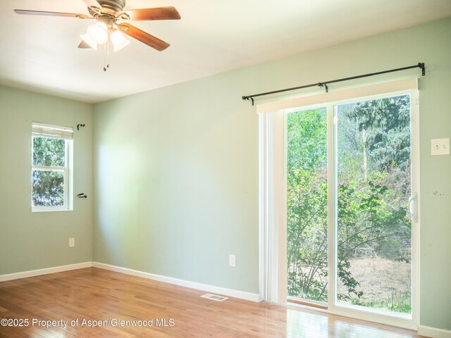 783 Orchard Rd, Montrose, CO 81401 - unfurnished room with baseboards, light wood-type flooring, and a ceiling fan