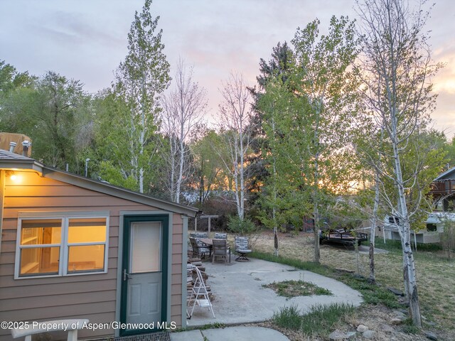 783 Orchard Rd, Montrose, CO 81401 - outdoor structure at dusk with outdoor dining area