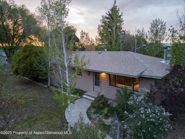 783 Orchard Rd, Montrose, CO 81401 - view of front facade with a shingled roof and covered porch