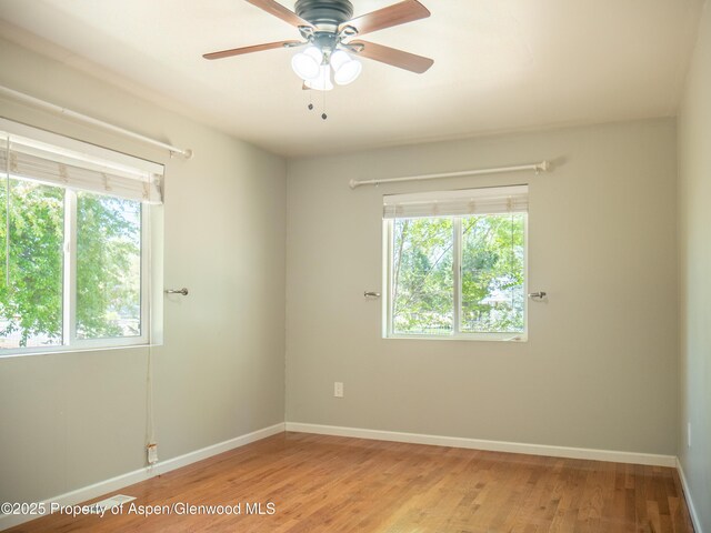 783 Orchard Rd, Montrose, CO 81401 - empty room featuring baseboards, ceiling fan, and light wood-style floors