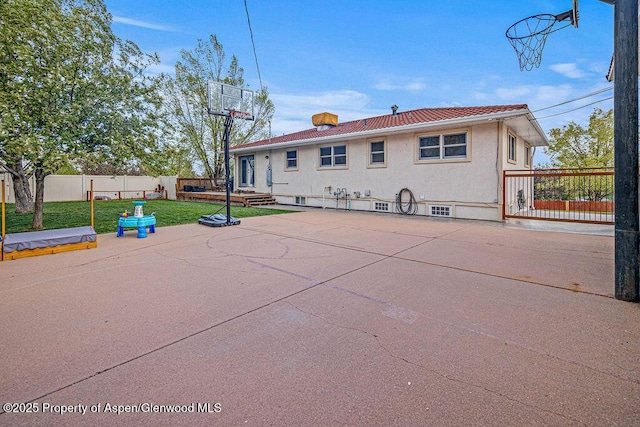 301 W 10th St, Craig, CO 81625 - back of house featuring stucco siding and a patio