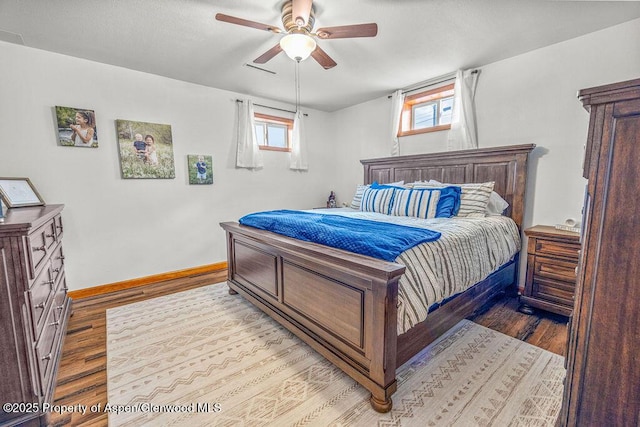 301 W 10th St, Craig, CO 81625 - bedroom featuring wood finished floors, baseboards, and ceiling fan