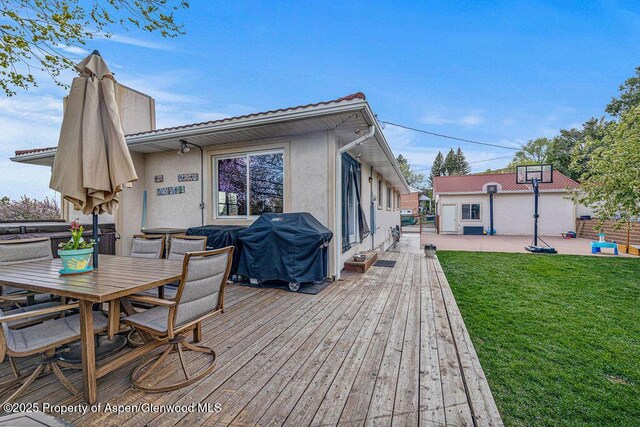301 W 10th St, Craig, CO 81625 - wooden deck with a grill and outdoor dining area