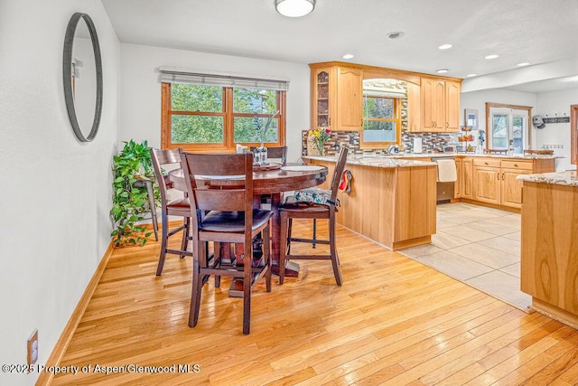 301 W 10th St, Craig, CO 81625 - dining area with light wood-style flooring, plenty of natural light, baseboards, and recessed lighting