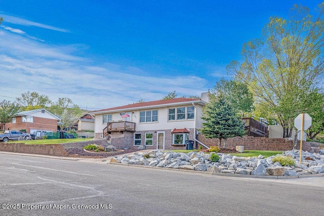 301 W 10th St, Craig, CO 81625 - view of front of house featuring a chimney and stucco siding