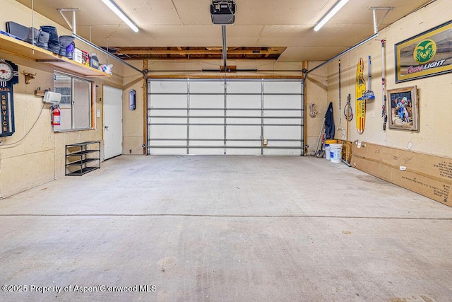 301 W 10th St, Craig, CO 81625 - garage featuring a garage door opener