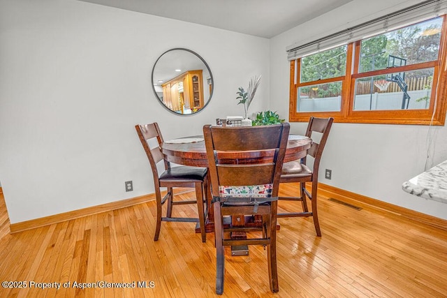 301 W 10th St, Craig, CO 81625 - dining room with baseboards and light wood-style flooring