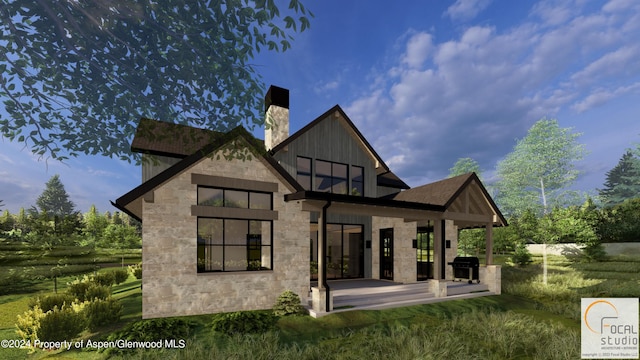 back of property with stone siding, a chimney, and board and batten siding