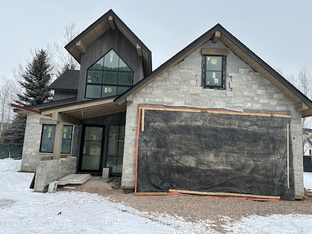 contemporary home featuring stone siding