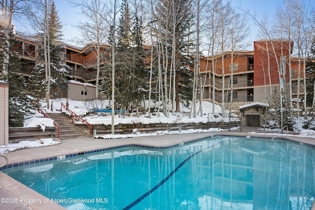 view of snow covered pool