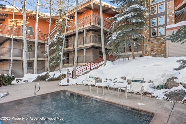 view of snow covered pool