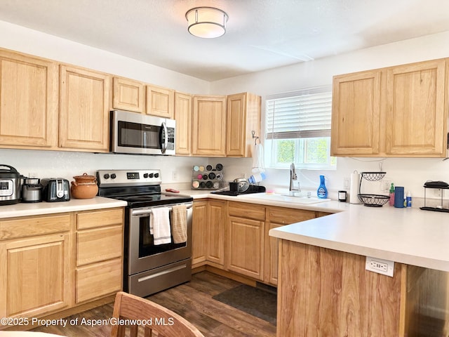 289 Mikala Ln, New Castle, CO 81647 - kitchen featuring stainless steel appliances, light brown cabinetry, and light countertops