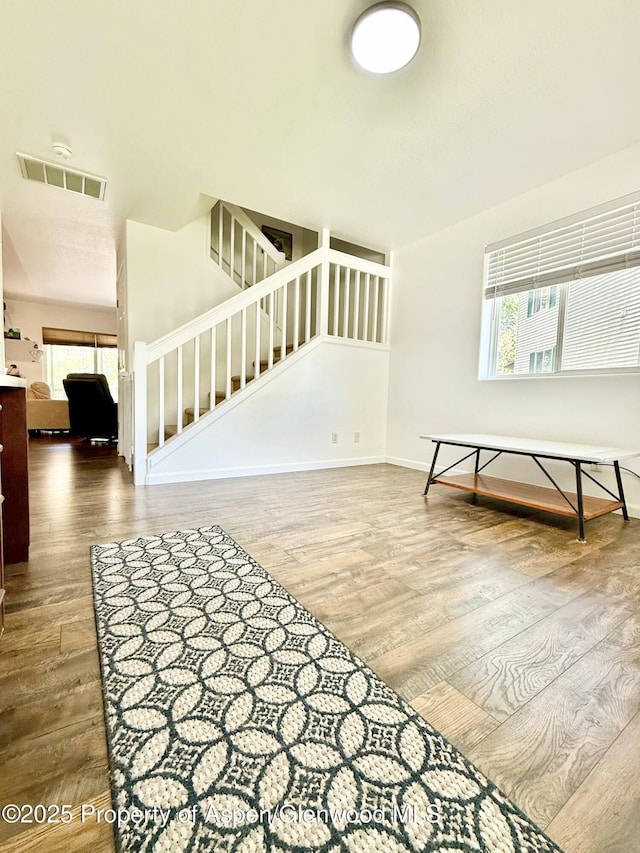 289 Mikala Ln, New Castle, CO 81647 - interior space featuring stairway, wood finished floors, and plenty of natural light