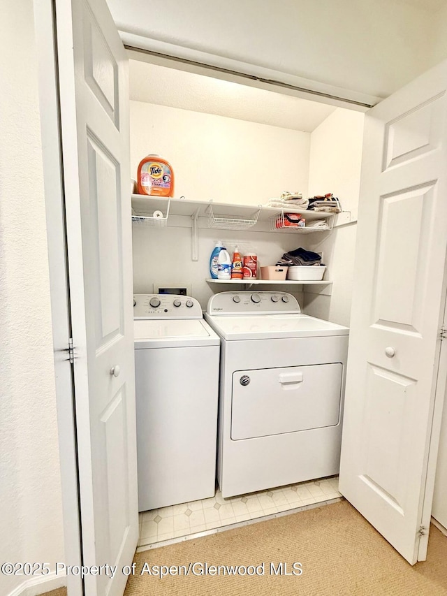 289 Mikala Ln, New Castle, CO 81647 - laundry room featuring washer and dryer and light flooring