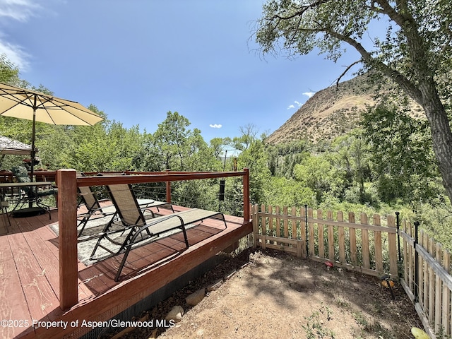 289 Mikala Ln, New Castle, CO 81647 - wooden terrace featuring a mountain view and outdoor dining area