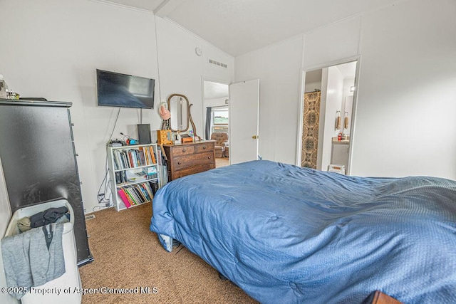carpeted bedroom with visible vents, crown molding, and vaulted ceiling